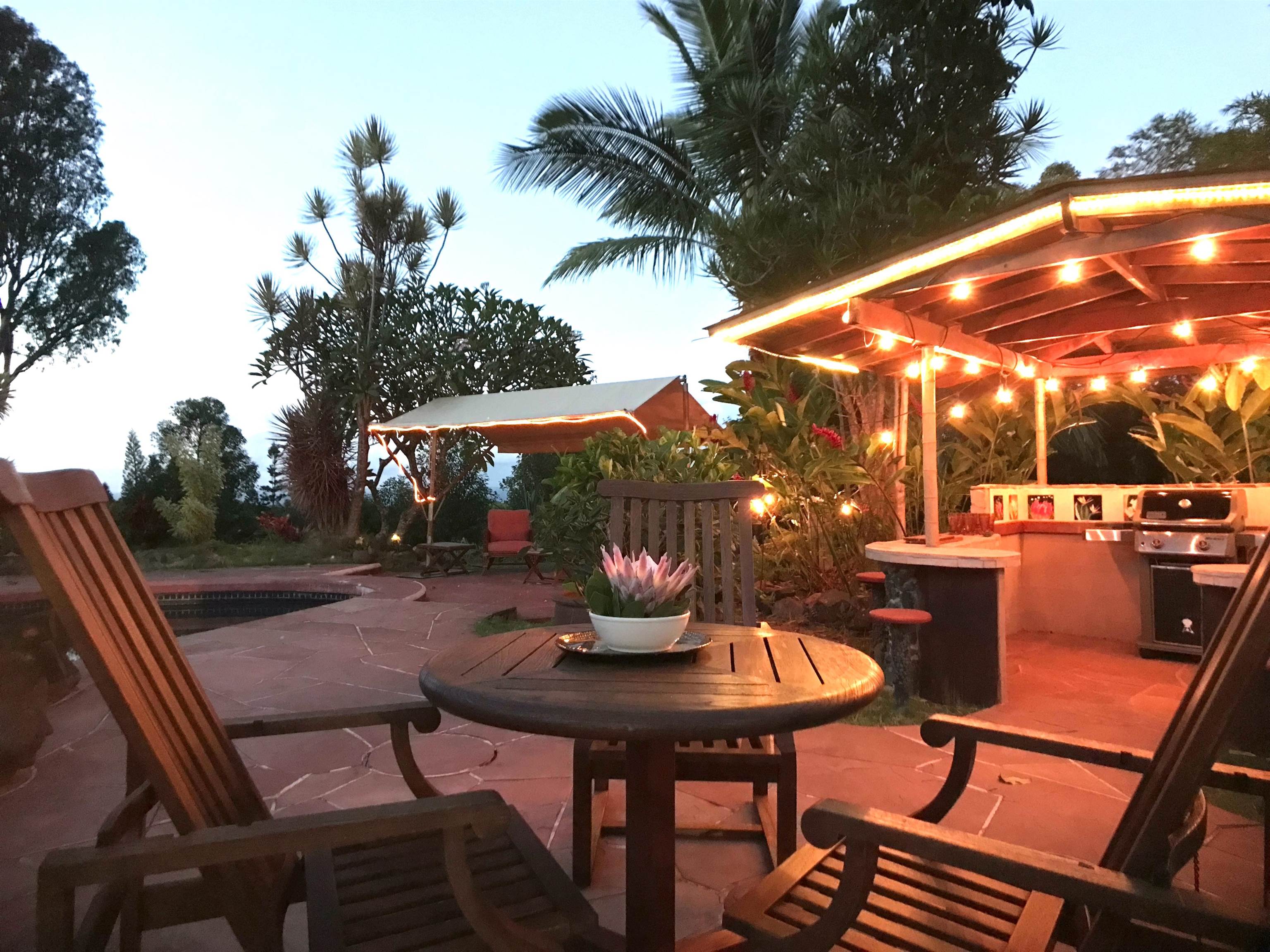 107 West Kuiaha Road Haiku, HI 96708 - Photo 29 of 49 a view of patio with table and chairs and potted plants
