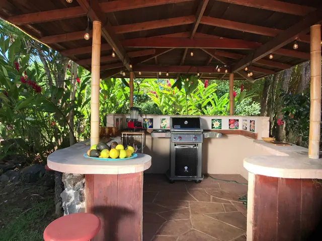 a view of a backyard with sitting area