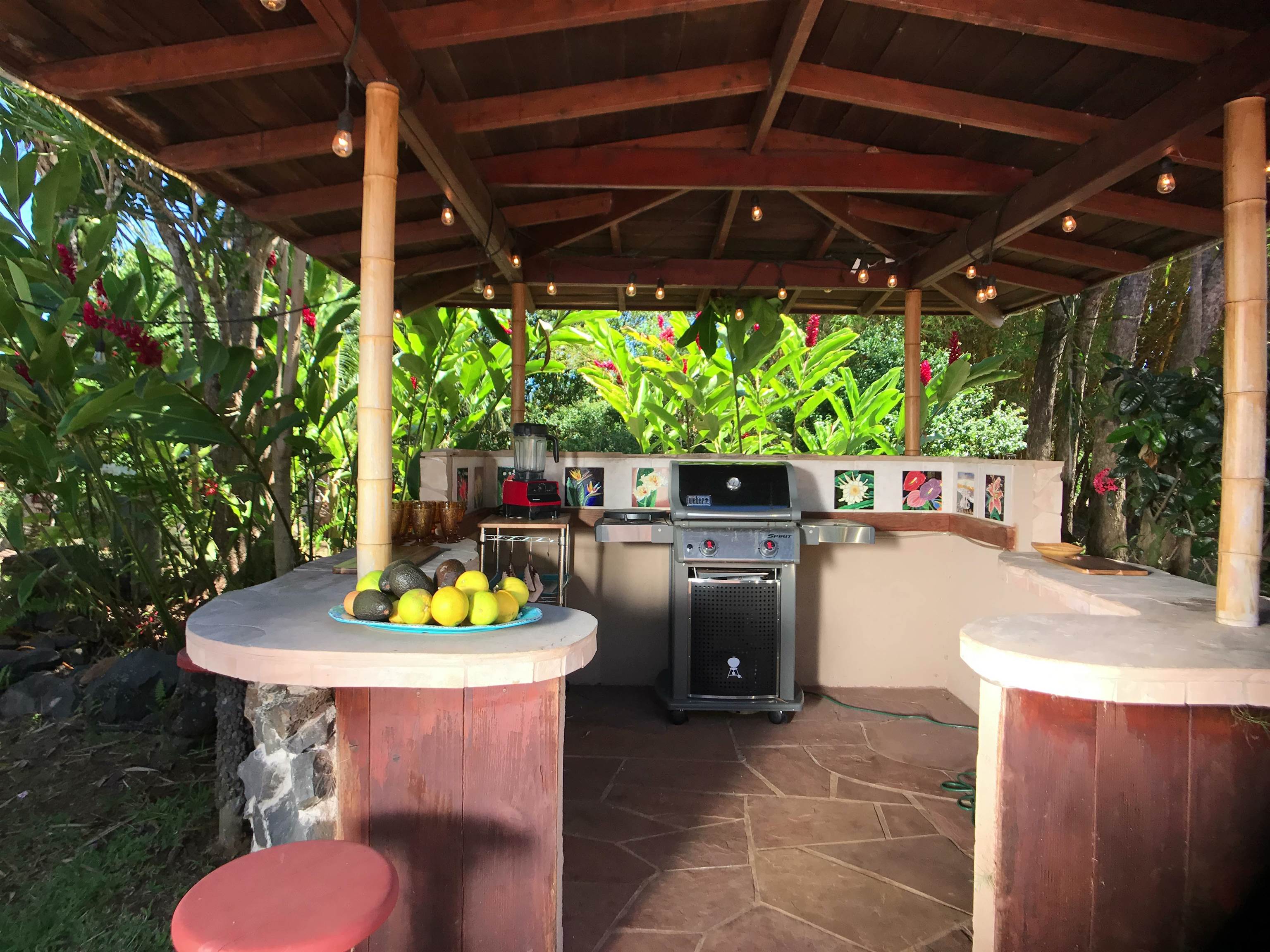 107 West Kuiaha Road Haiku, HI 96708 - Photo 31 of 49 a patio with water table and chairs