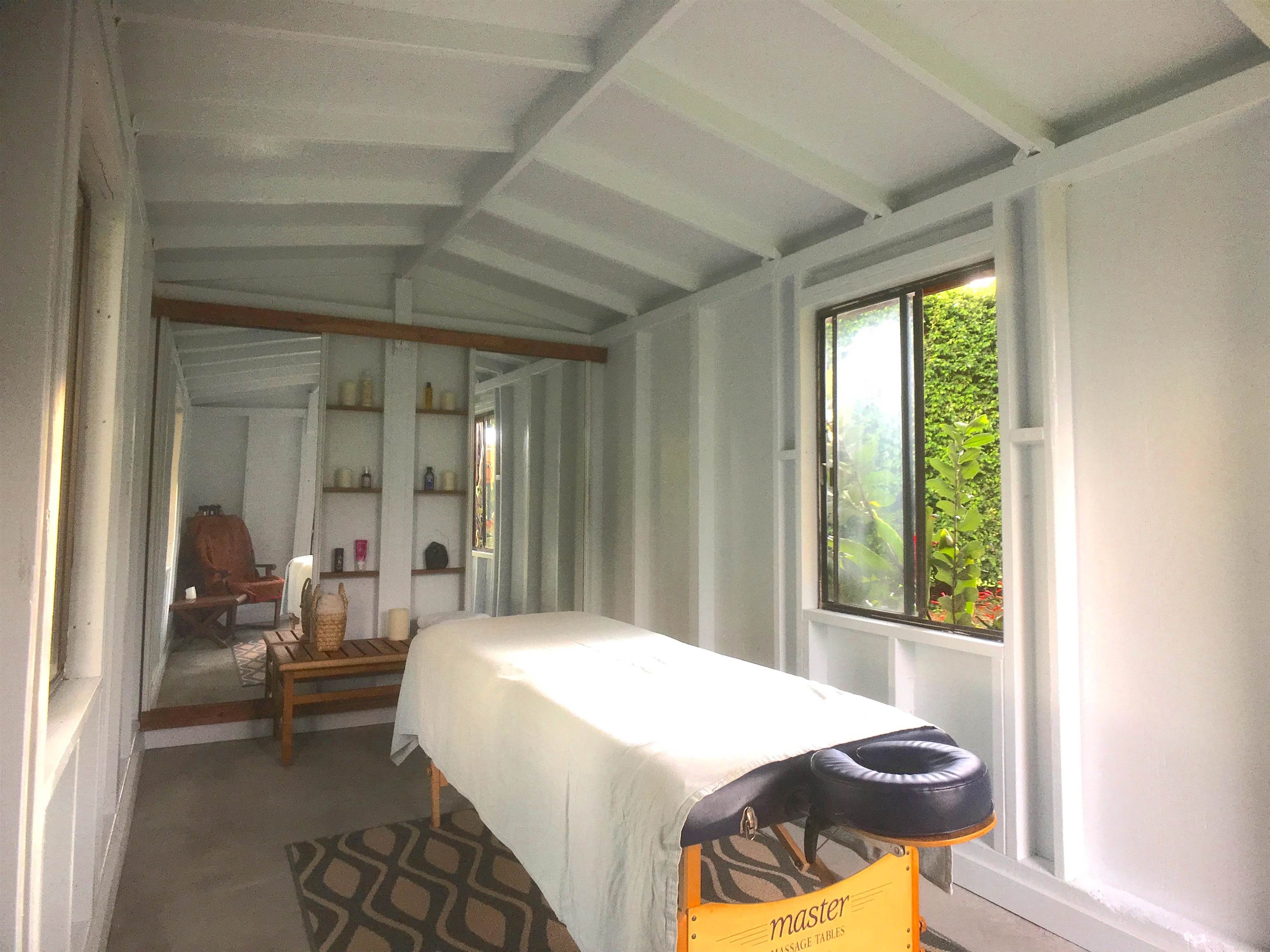 107 West Kuiaha Road Haiku, HI 96708 - Photo 39 of 49 a bedroom with a bed and glass window