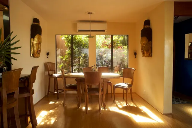 a view of a dining room with furniture window and outside view