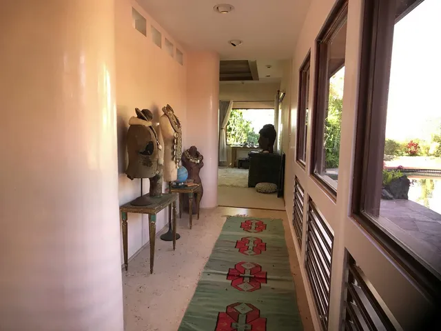 a room with furniture and a potted plant