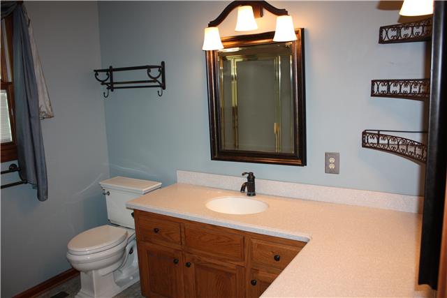 711 3rd Avenue West Springfield, TN 37172 - Photo 8 of 16 a bathroom with a toilet sink and mirror