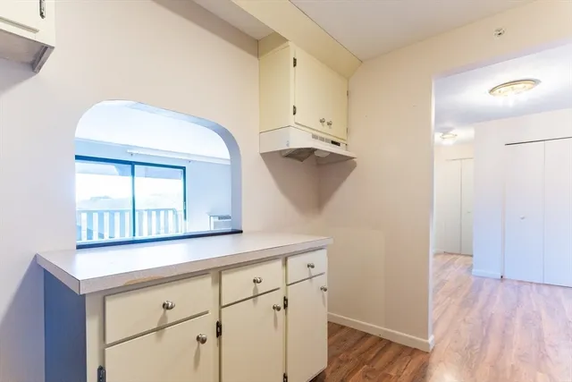 a hallway with view of wooden floor