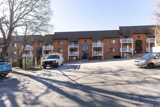 a view of a car park in front of a building
