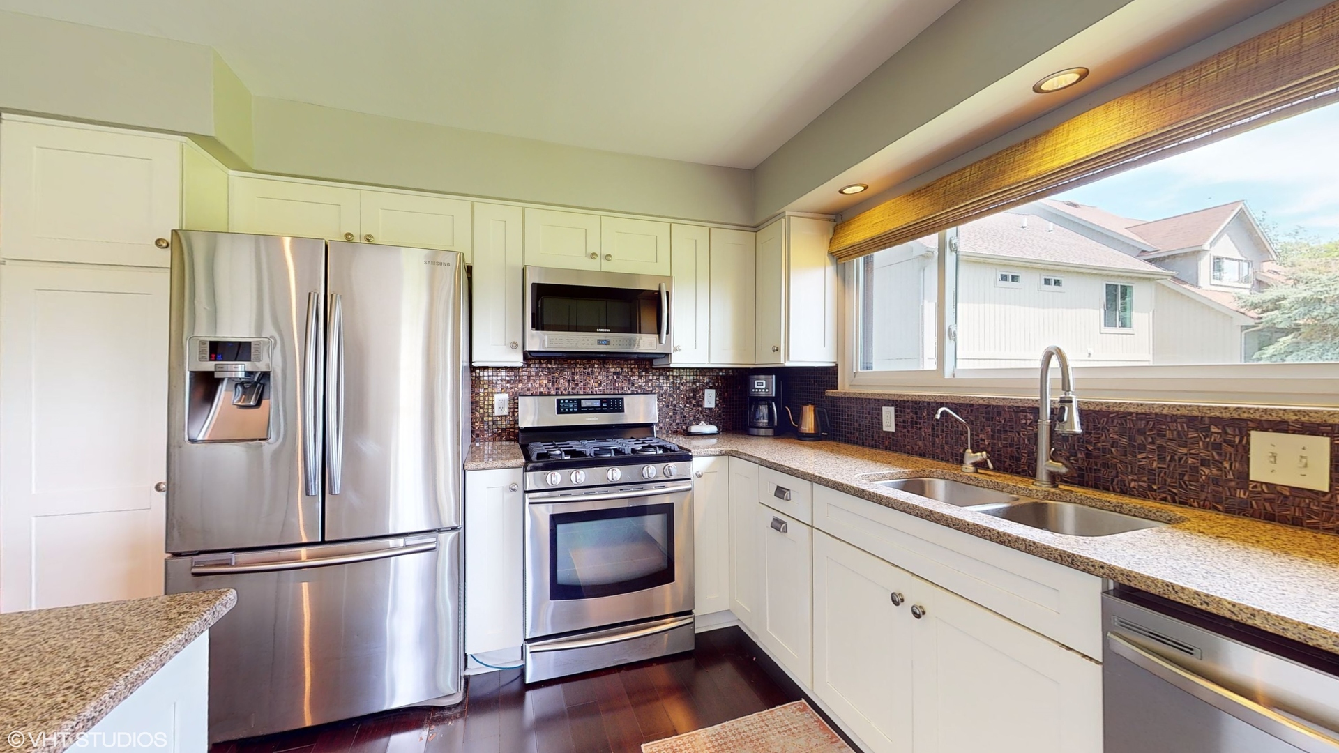 4213 White Ash Road Crystal Lake, IL 60014 - Photo 11 of 43 a kitchen with a refrigerator stove and sink