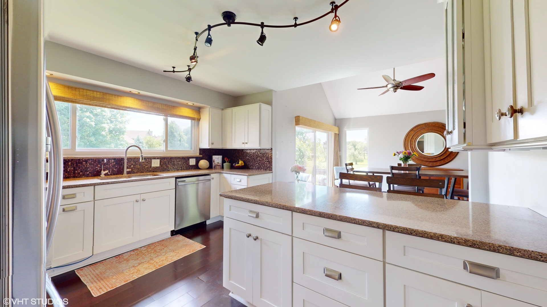 4213 White Ash Road Crystal Lake, IL 60014 - Photo 12 of 43 a kitchen with sink cabinets and dining table