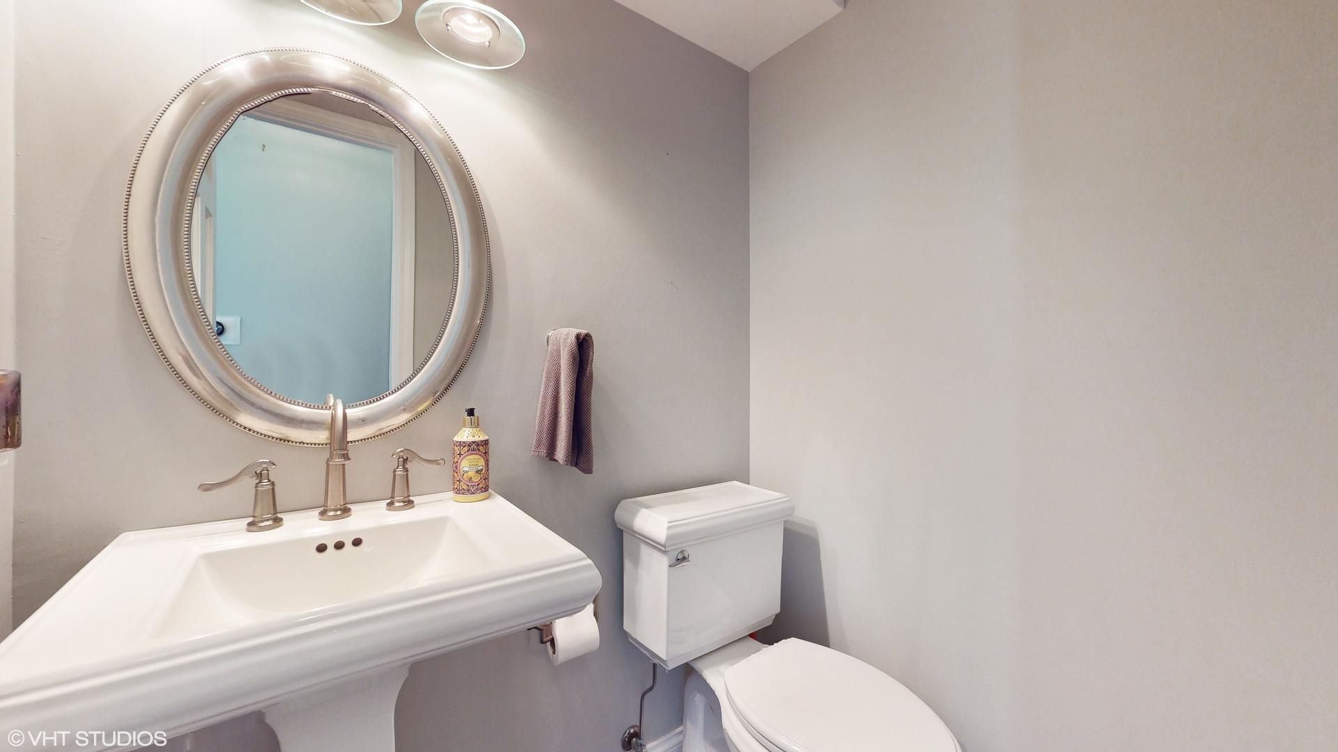 4213 White Ash Road Crystal Lake, IL 60014 - Photo 19 of 43 a bathroom with a toilet sink and mirror