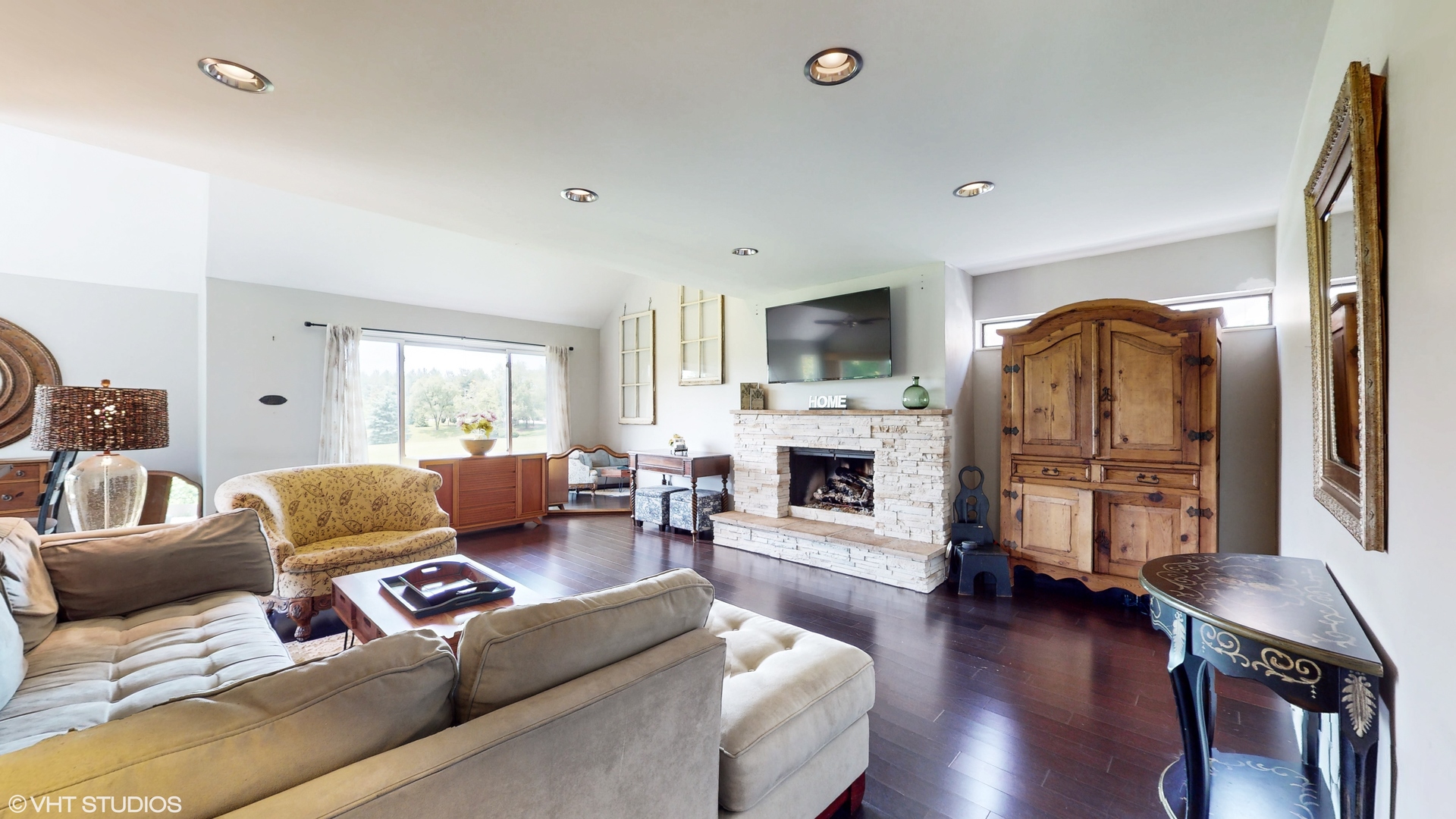 4213 White Ash Road Crystal Lake, IL 60014 - Photo 3 of 43 a living room with fireplace furniture and a wooden floor