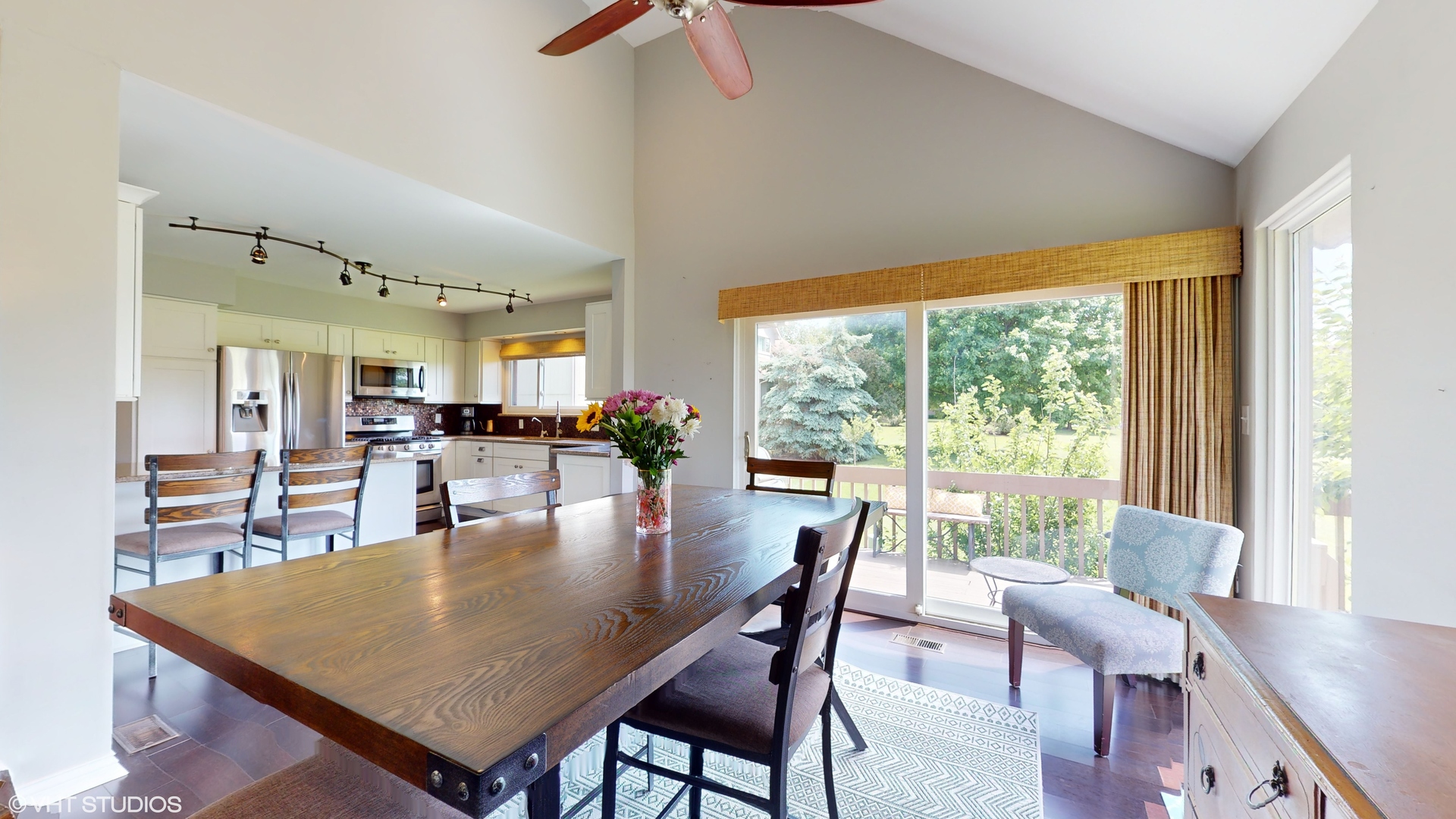 4213 White Ash Road Crystal Lake, IL 60014 - Photo 9 of 43 a dining room with furniture and wooden floor