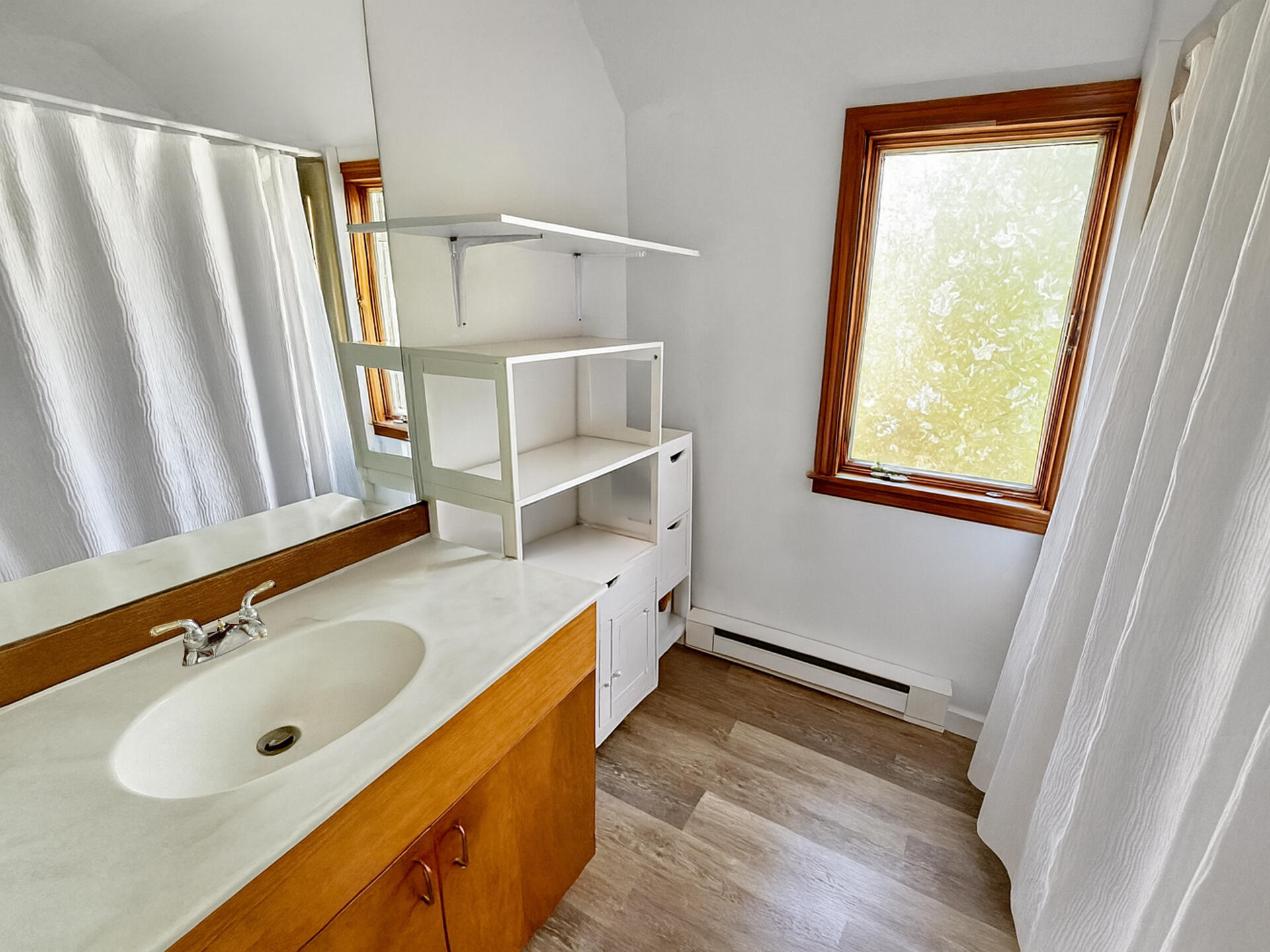 47 Quenames Road Chilmark, MA 02535 - Photo 6 of 7 a bathroom with a sink a mirror and a shower