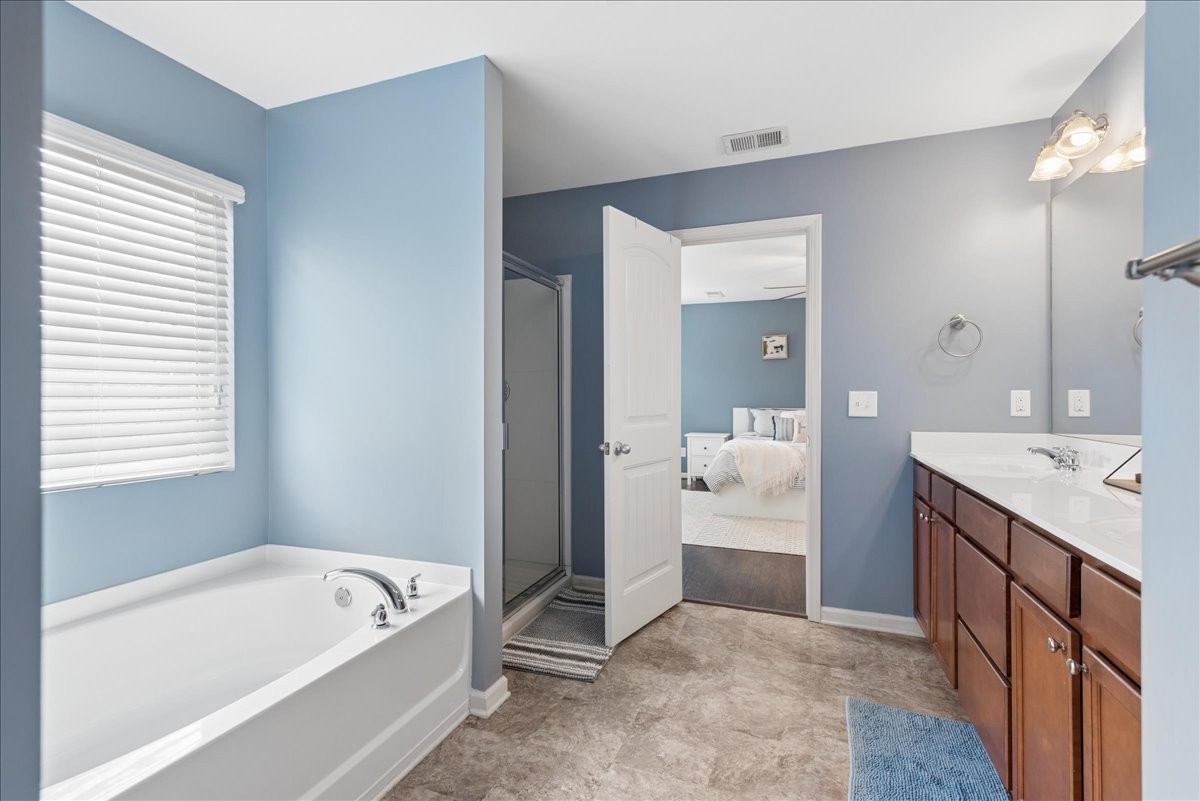 960 Morning Road Antioch, TN 37013 - Photo 22 of 36 a bathroom with a tub a double vanity sink and mirror