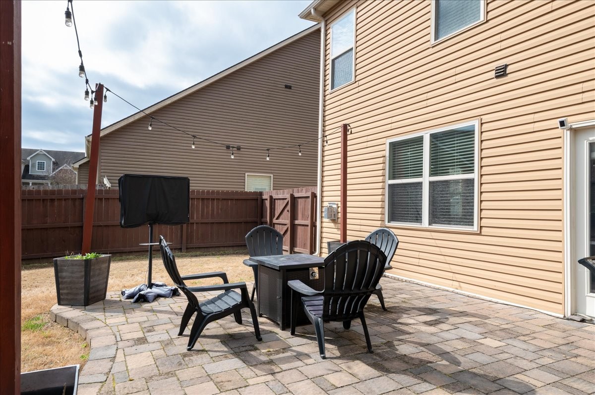 960 Morning Road Antioch, TN 37013 - Photo 34 of 36 a patio with table and chairs and potted plants