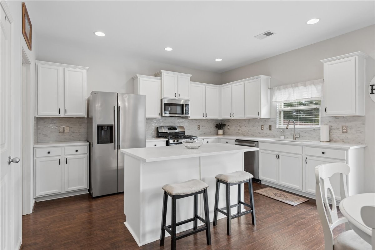 960 Morning Road Antioch, TN 37013 - Photo 9 of 36 a kitchen with stainless steel appliances a refrigerator stove microwave and cabinets