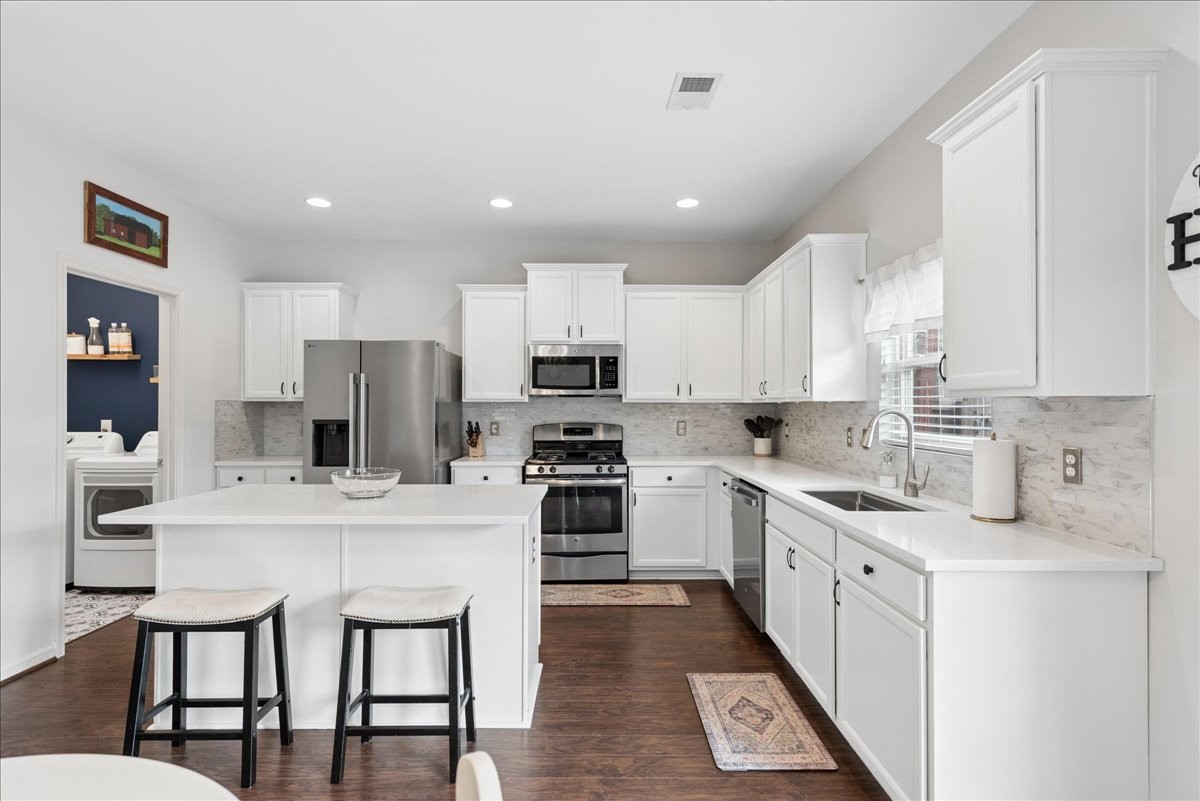 960 Morning Road Antioch, TN 37013 - Photo 10 of 36 a kitchen with stainless steel appliances a stove refrigerator sink and cabinets