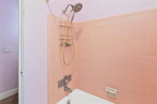 a white toilet sitting next to a white sink