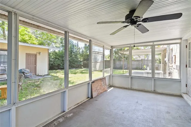 a view of a house with backyard and porch