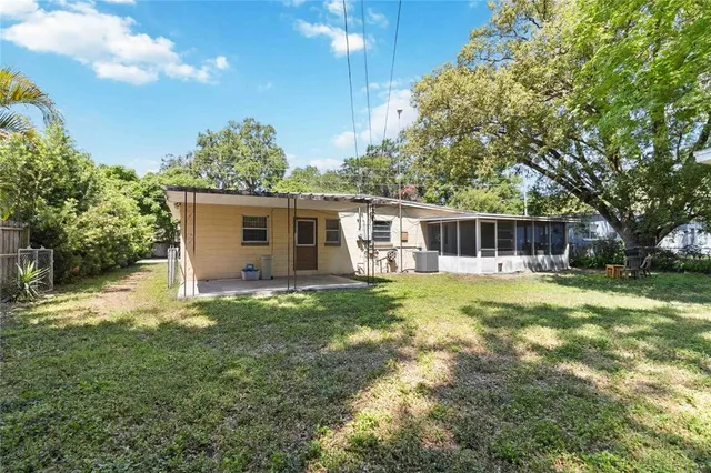 a view of a backyard with a small cabin
