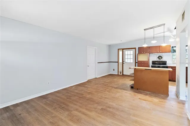 a view of a kitchen with a sink and a refrigerator