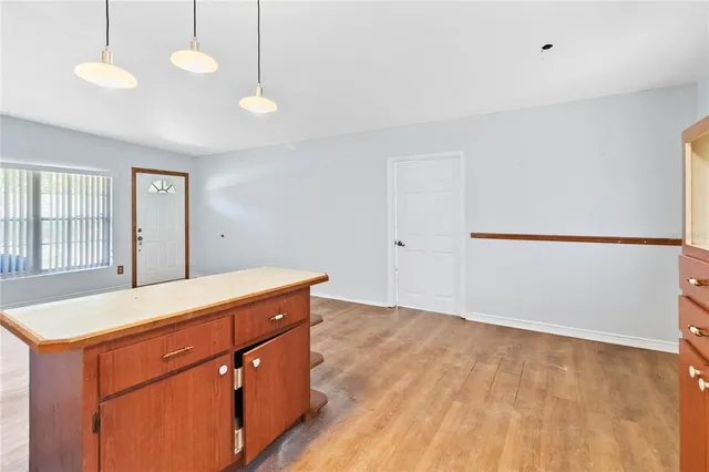 a room with a sink and chandelier