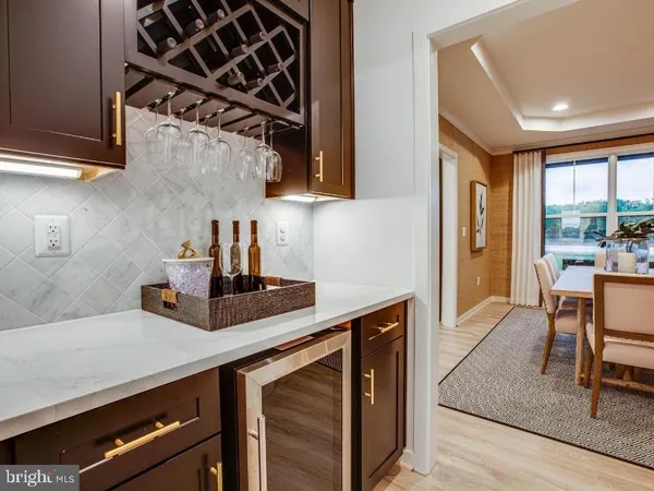 a kitchen with a sink cabinets and window