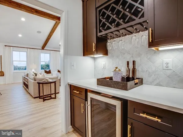 a kitchen with a sink cabinets and wooden floor