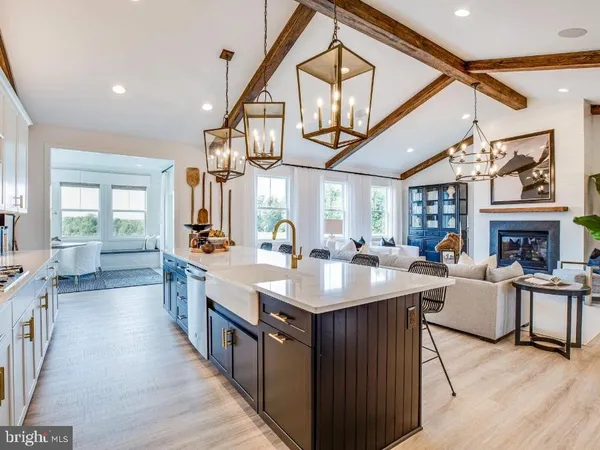 a large white kitchen with a large window