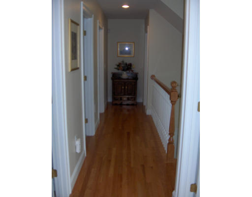 18 Symonds Way Reading, MA 01867 - Photo 13 of 26 a view of a hallway with wooden floor