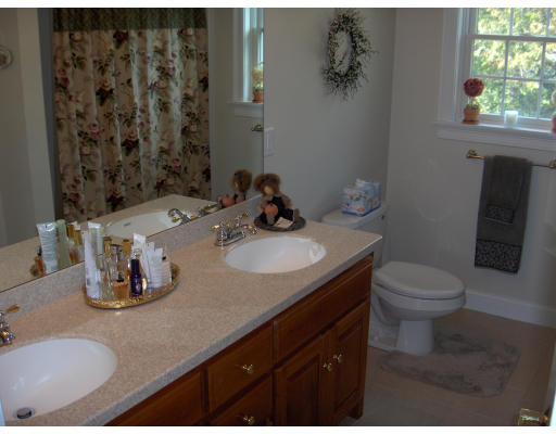 18 Symonds Way Reading, MA 01867 - Photo 17 of 26 a bathroom with a granite countertop sink toilet and a mirror