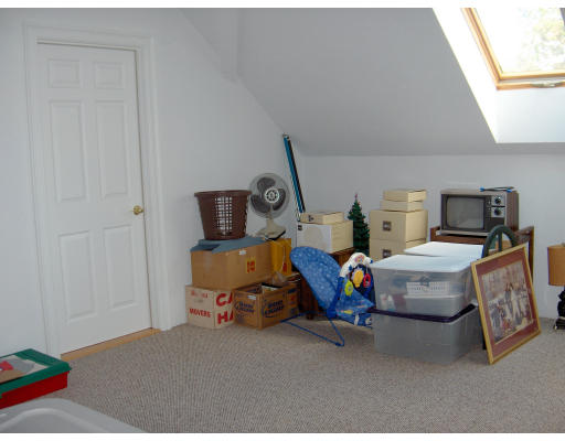 18 Symonds Way Reading, MA 01867 - Photo 19 of 26 a bedroom with bed and window