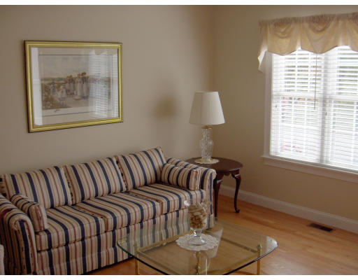 18 Symonds Way Reading, MA 01867 - Photo 2 of 26 a bedroom with furniture and a window