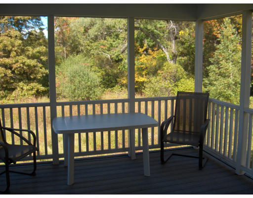 18 Symonds Way Reading, MA 01867 - Photo 22 of 26 a view of a wooden bench in balcony