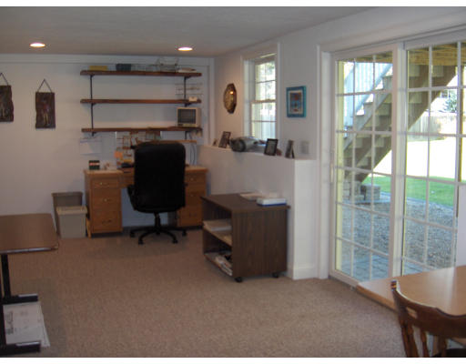 18 Symonds Way Reading, MA 01867 - Photo 24 of 26 a room with furniture and a window