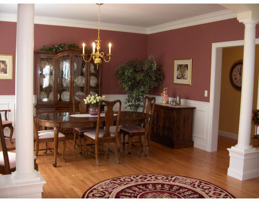 18 Symonds Way Reading, MA 01867 - Photo 6 of 26 a view of a dining room with furniture and chandelier
