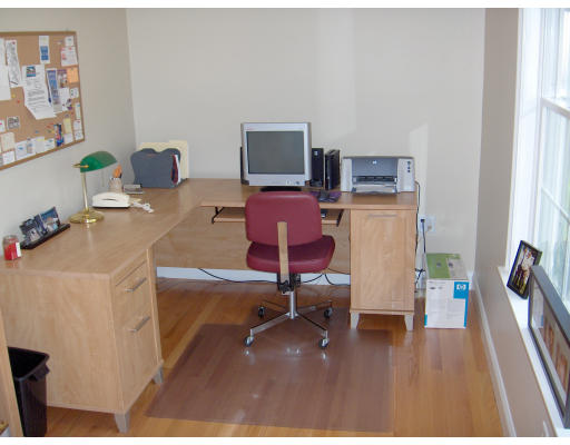 18 Symonds Way Reading, MA 01867 - Photo 8 of 26 a living room with furniture and a flat screen tv