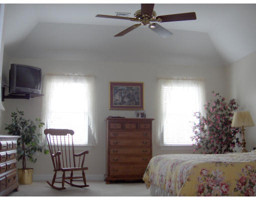 18 Symonds Way Reading, MA 01867 - Photo 10 of 26 a bedroom with furniture and a window