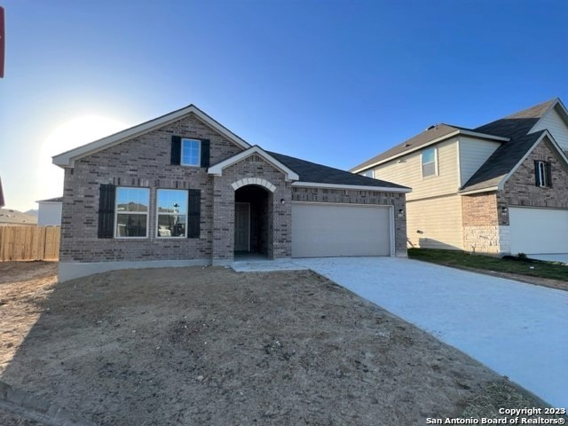 4823 Serpens San Antonio, TX 78245 - Photo 1 of 36 a front view of a house with a yard and garage