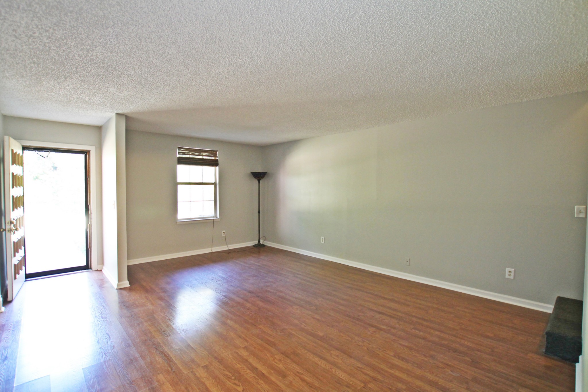1301 Neelys Bend Road, Unit 91 Madison, TN 37115 - Photo 15 of 33 a view of an empty room with wooden floor and a window