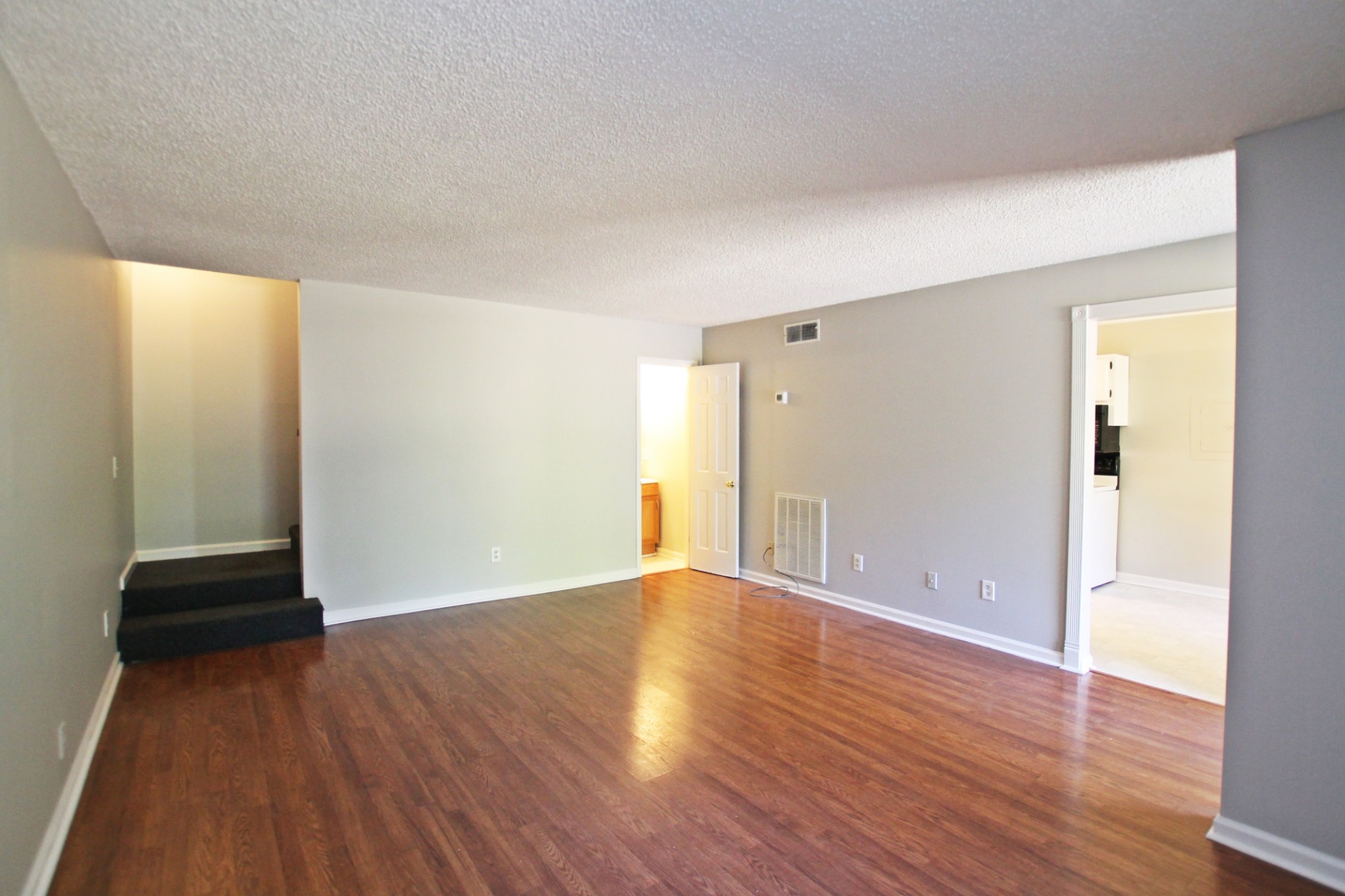 1301 Neelys Bend Road, Unit 91 Madison, TN 37115 - Photo 16 of 33 wooden floor in an empty room with a window