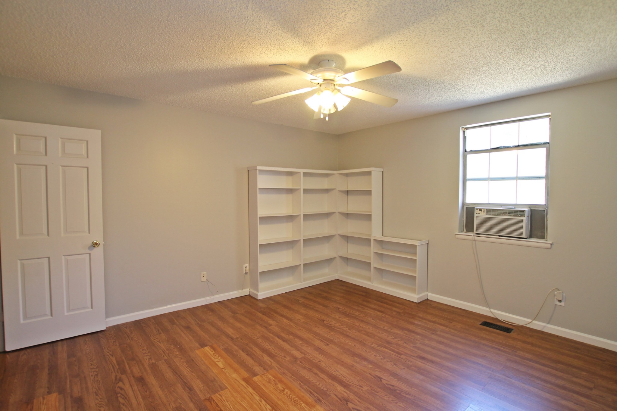 1301 Neelys Bend Road, Unit 91 Madison, TN 37115 - Photo 21 of 33 wooden floor in an empty room with a window