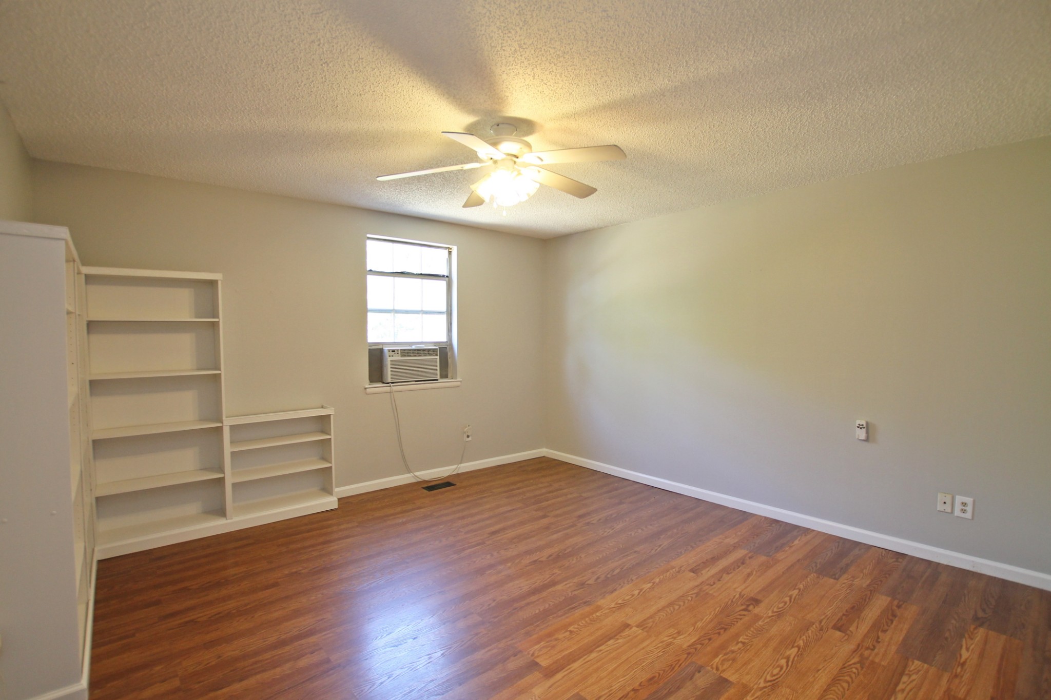 1301 Neelys Bend Road, Unit 91 Madison, TN 37115 - Photo 22 of 33 wooden floor in an empty room with a window