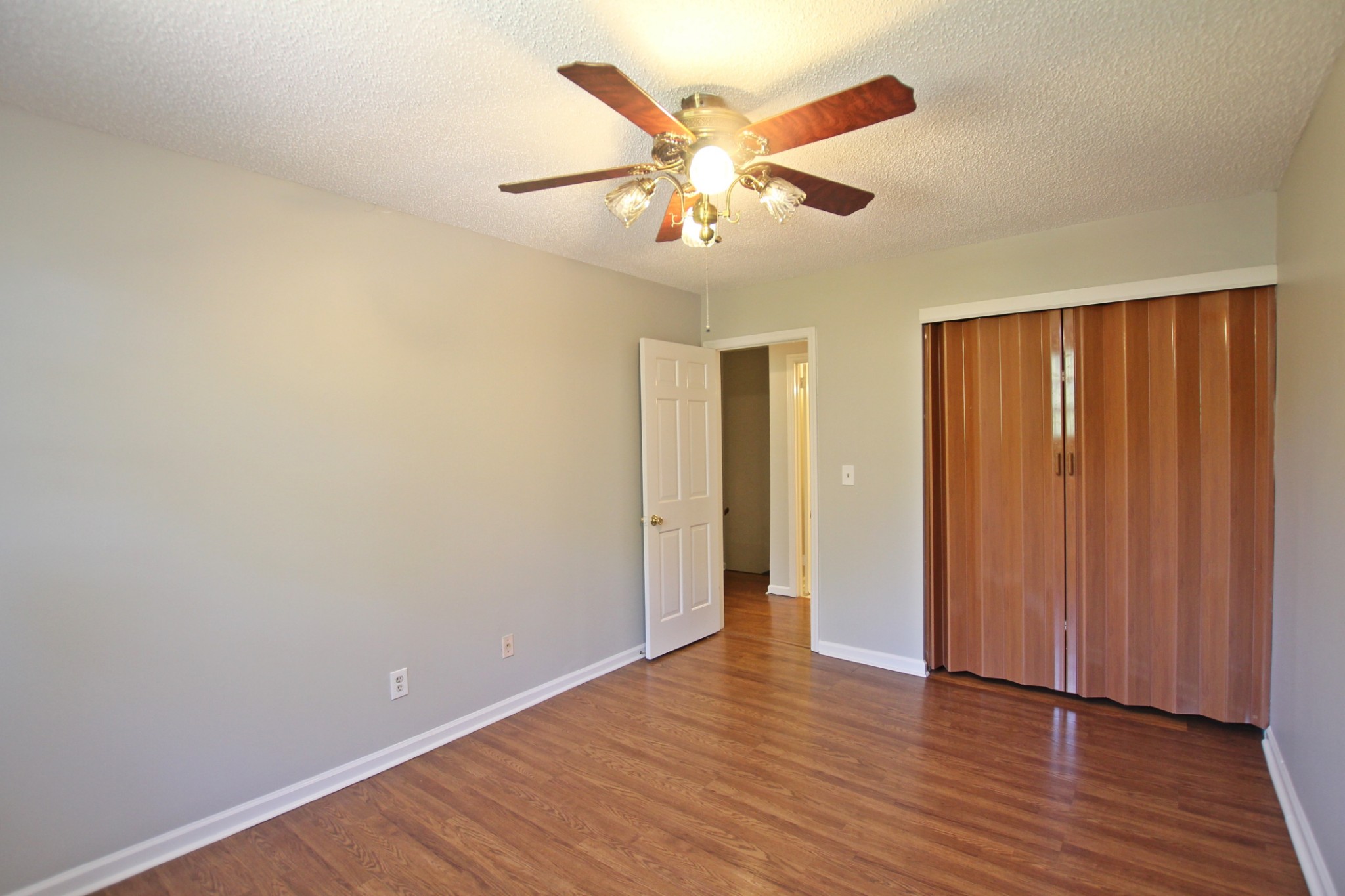 1301 Neelys Bend Road, Unit 91 Madison, TN 37115 - Photo 26 of 33 an empty room with wooden floor fan and windows