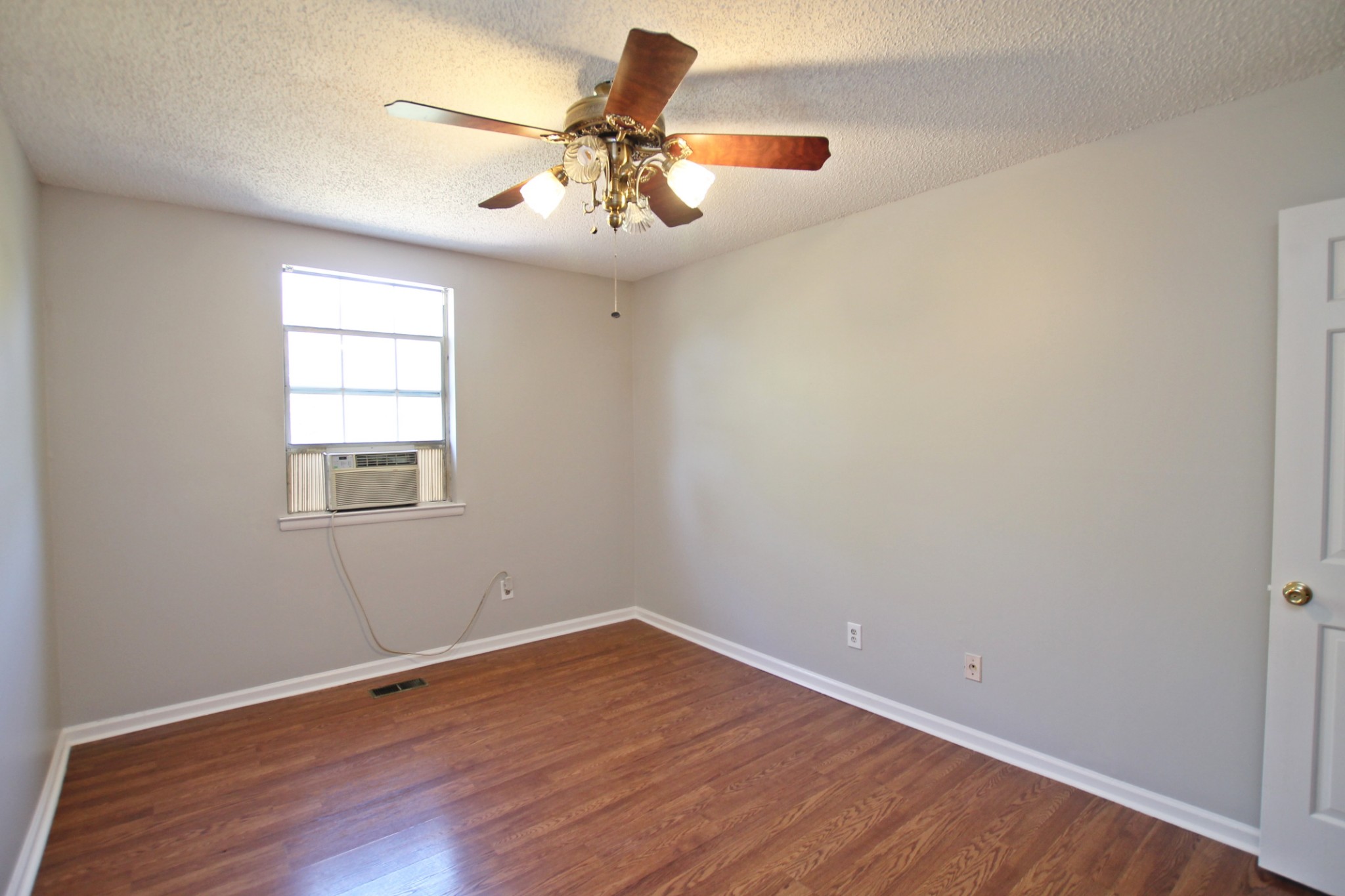 1301 Neelys Bend Road, Unit 91 Madison, TN 37115 - Photo 27 of 33 wooden floor in an empty room with a window