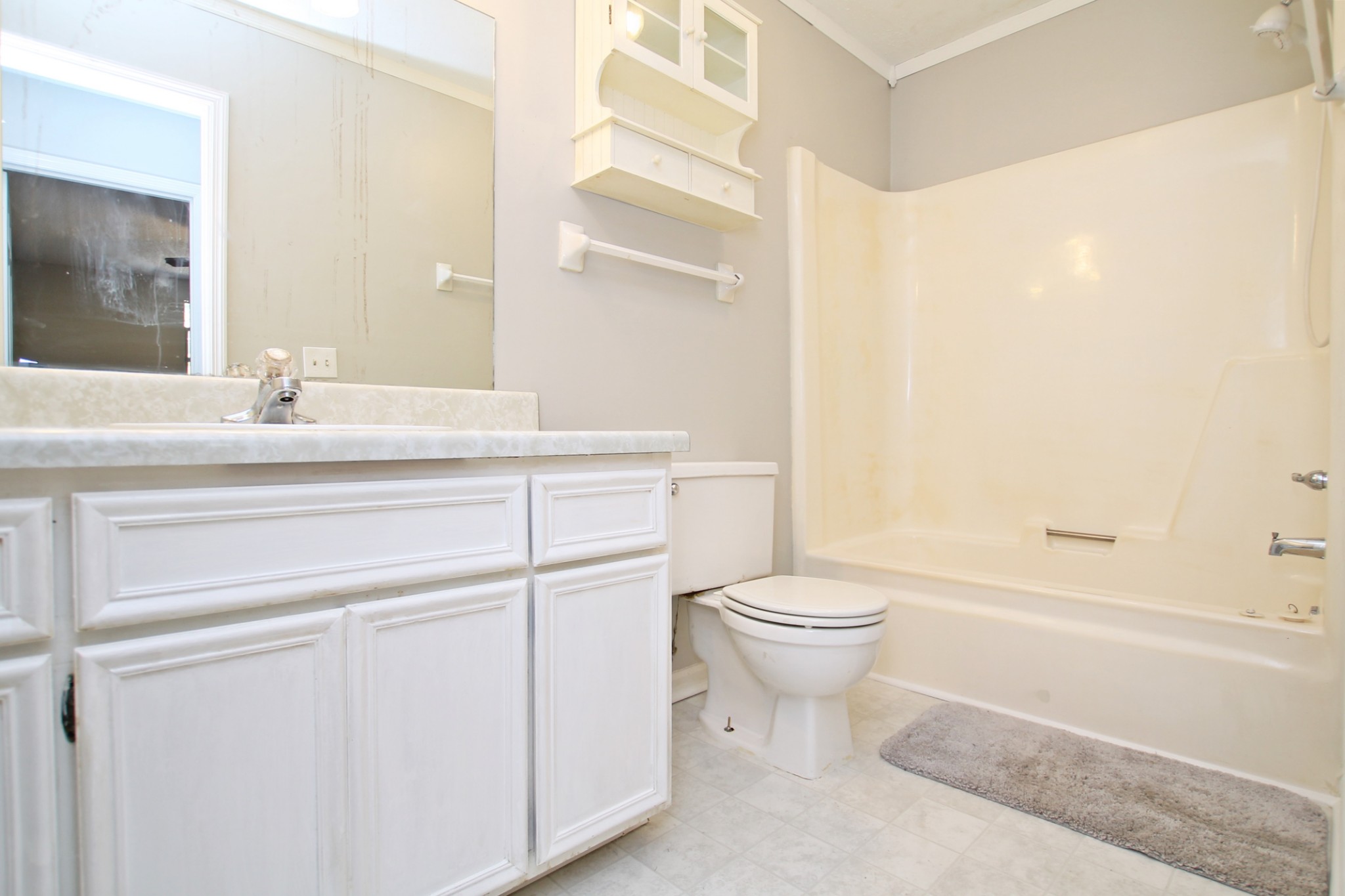 1301 Neelys Bend Road, Unit 91 Madison, TN 37115 - Photo 29 of 33 a bathroom with a sink a toilet and a mirror