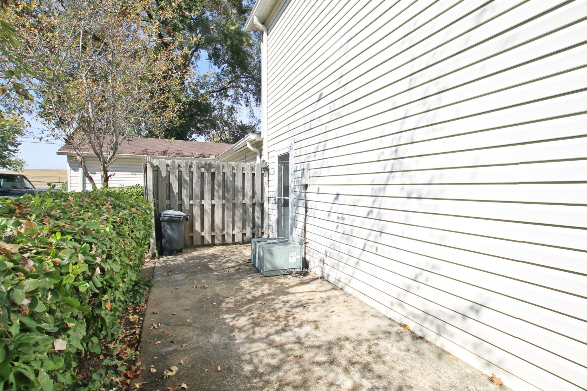 1301 Neelys Bend Road, Unit 91 Madison, TN 37115 - Photo 32 of 33 a view of a pathway with a white house