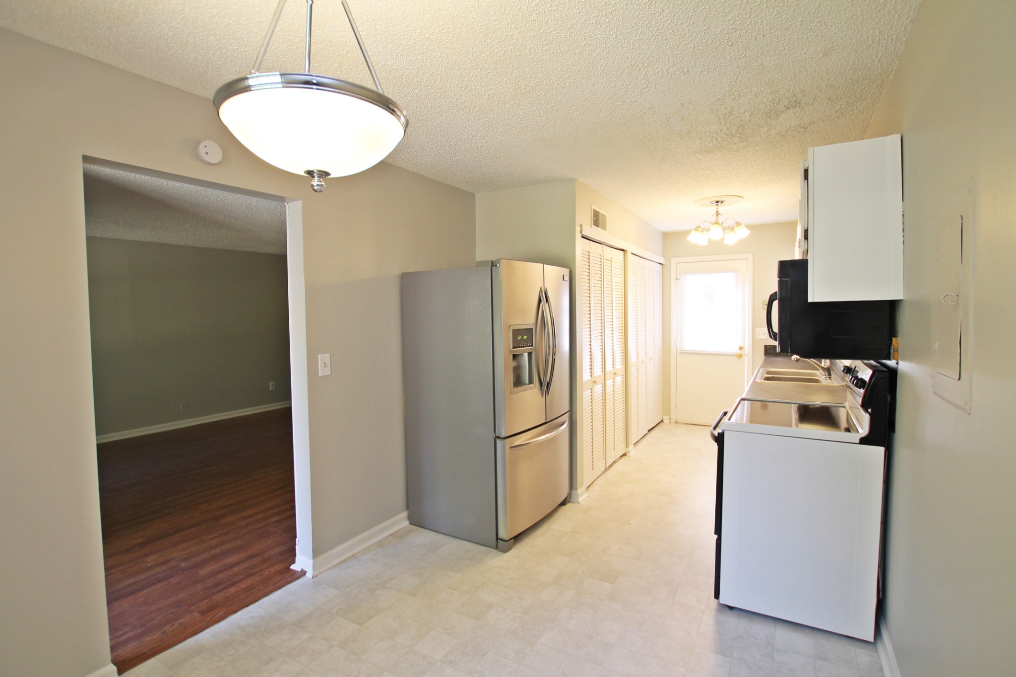 1301 Neelys Bend Road, Unit 91 Madison, TN 37115 - Photo 5 of 33 a kitchen with stainless steel appliances a refrigerator and a sink