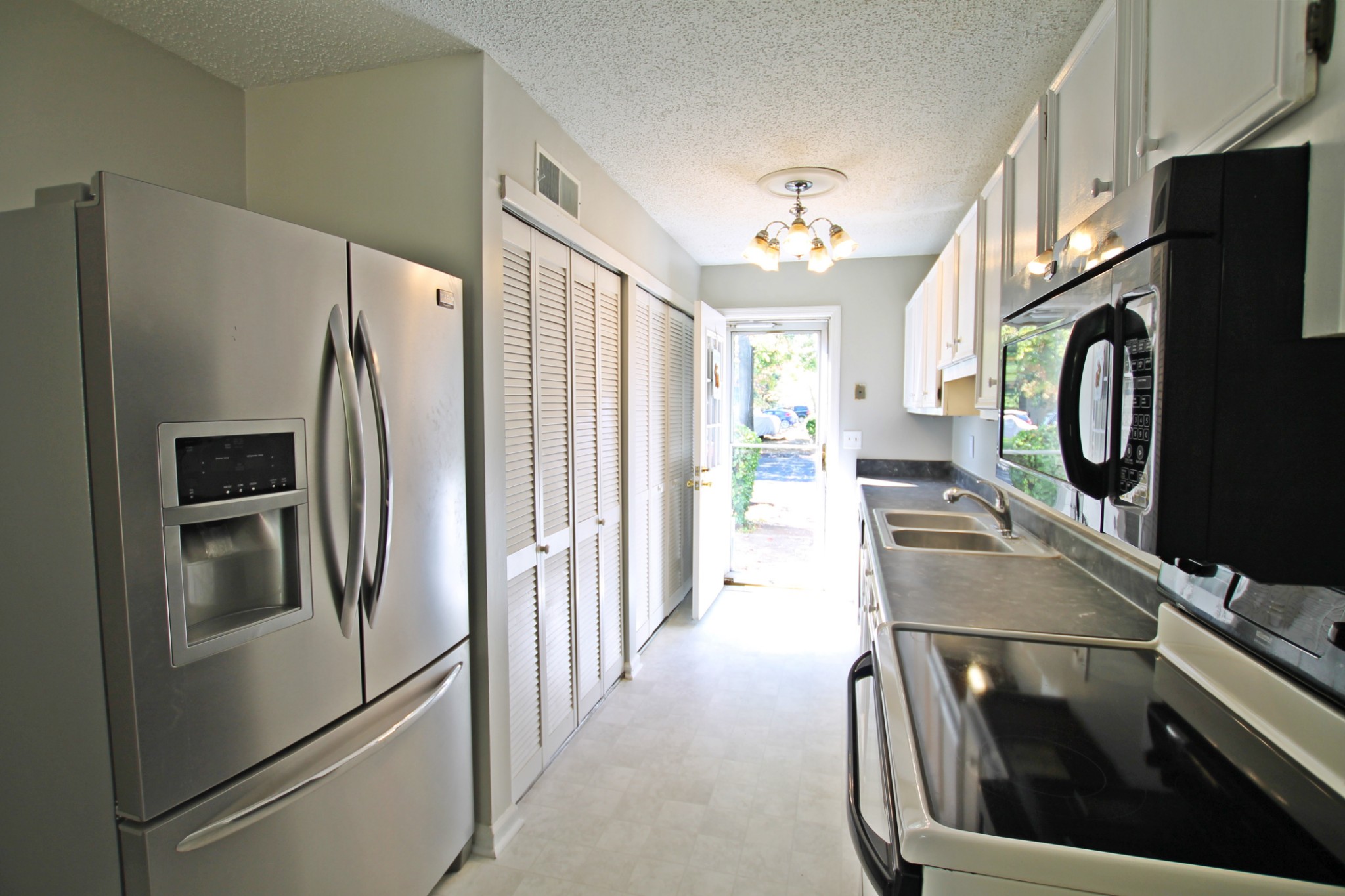 1301 Neelys Bend Road, Unit 91 Madison, TN 37115 - Photo 8 of 33 a kitchen with stainless steel appliances a refrigerator and a stove