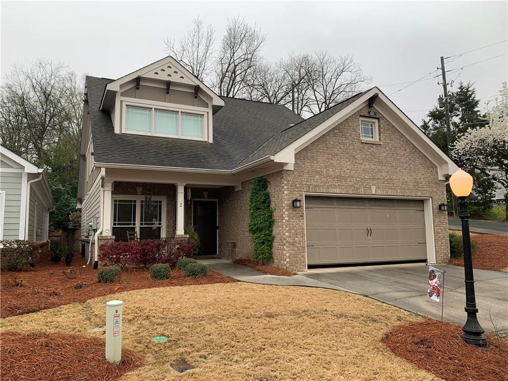 2 Pear Street Rome, GA 30161 - Photo 1 of 1 a front view of a house with a yard and garage