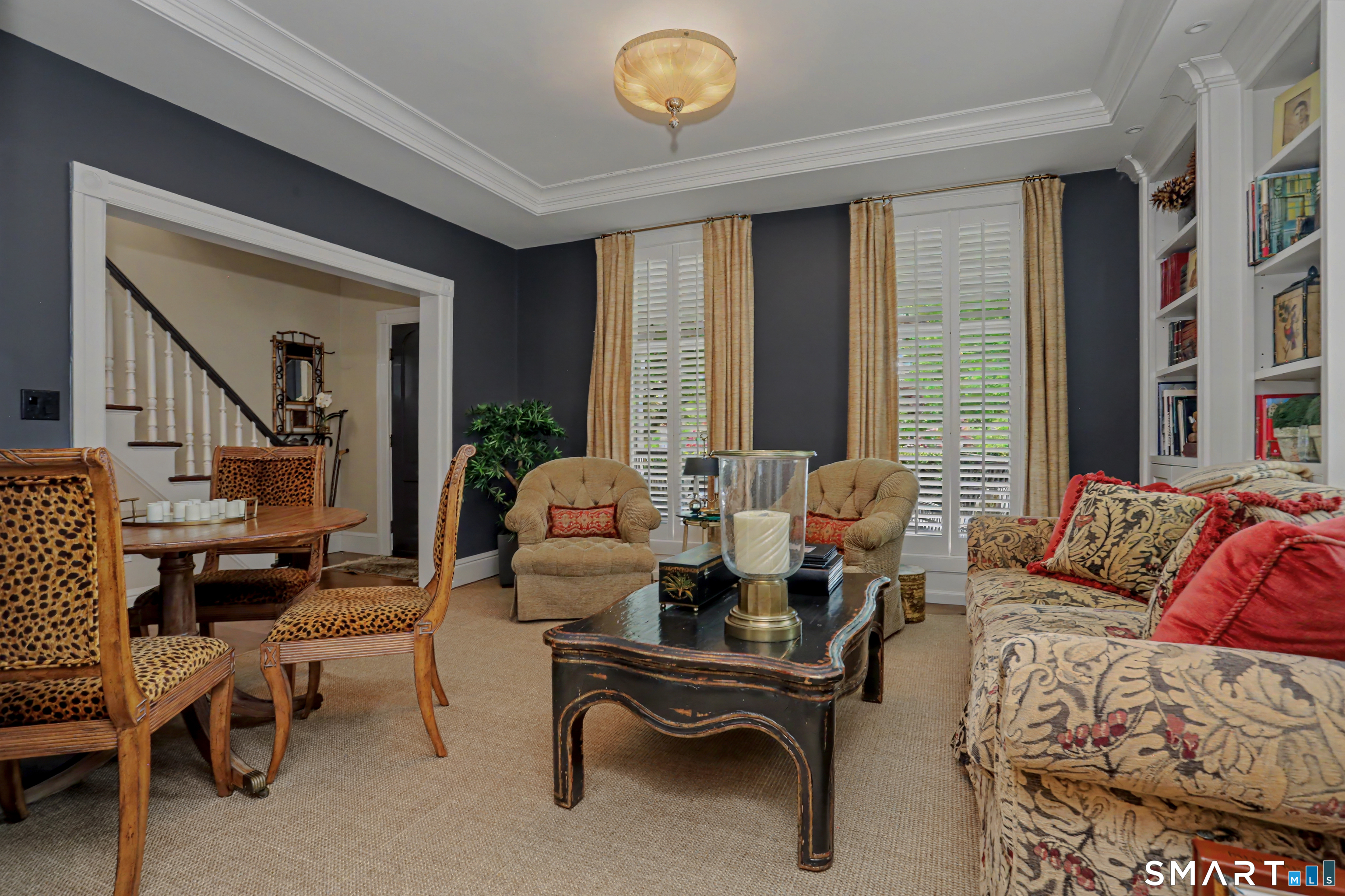 36 Catoonah Street, Unit 18 Ridgefield, CT 06877 - Photo 9 of 40 a living room with furniture and a large window