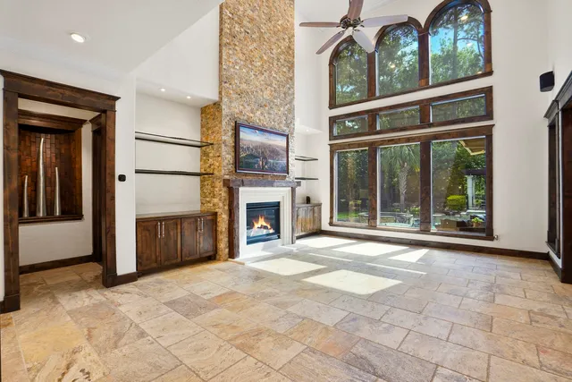 a spacious bedroom with a balcony a bed and a couch